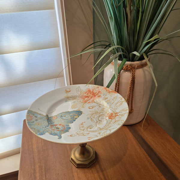 blue butterflies and brass candle holder