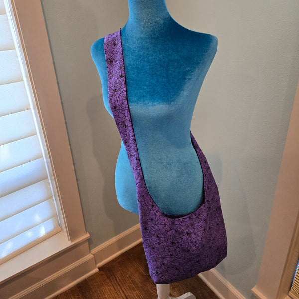 purple spider sling purse