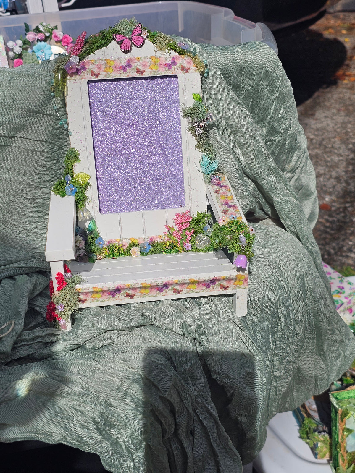 Enchanted Frame Chair decorated with flowers, moss, butterflies and a fairy.