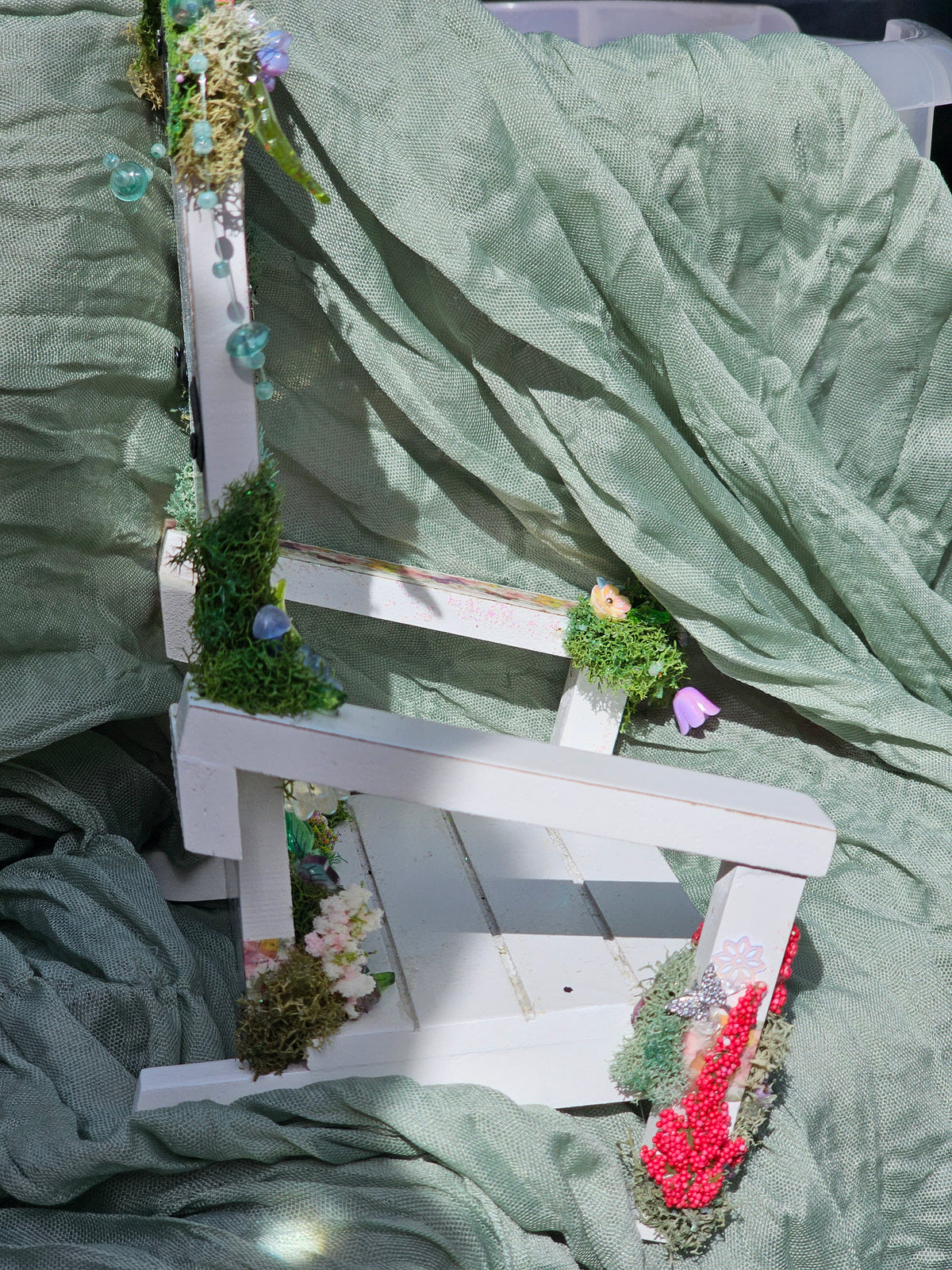 Enchanted Frame Chair decorated with flowers, moss, butterflies and a fairy.