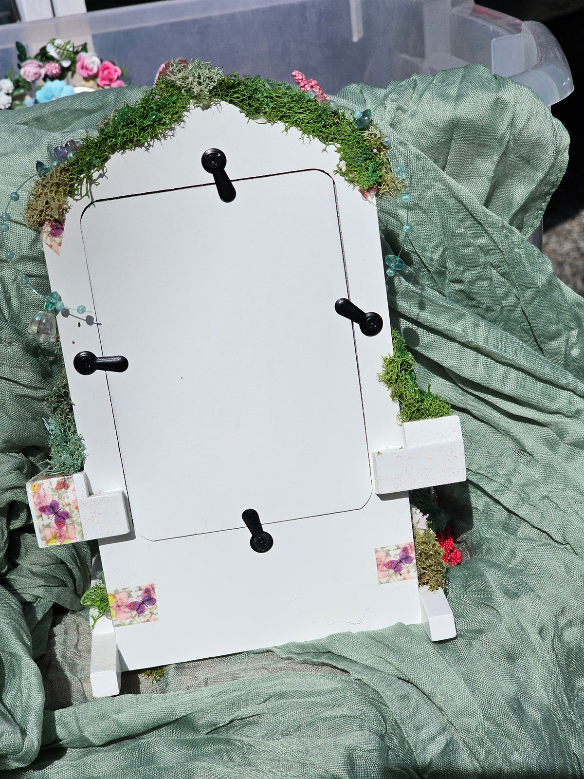 Enchanted Frame Chair decorated with flowers, moss, butterflies and a fairy.