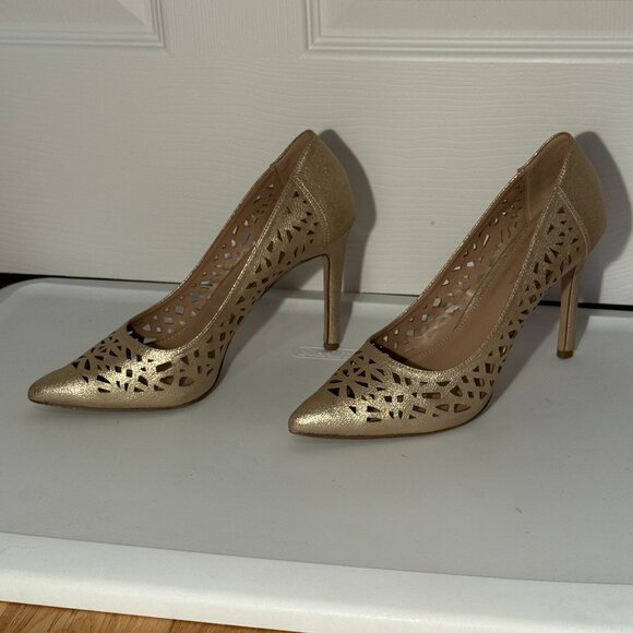 BCBGeneration gold cutout pumps