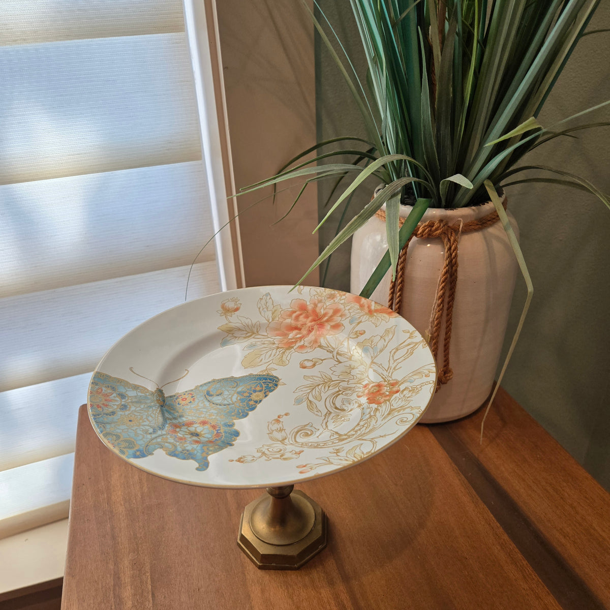 blue butterflies and brass candle holder