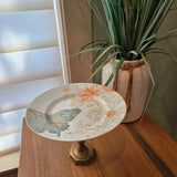 blue butterflies and brass candle holder