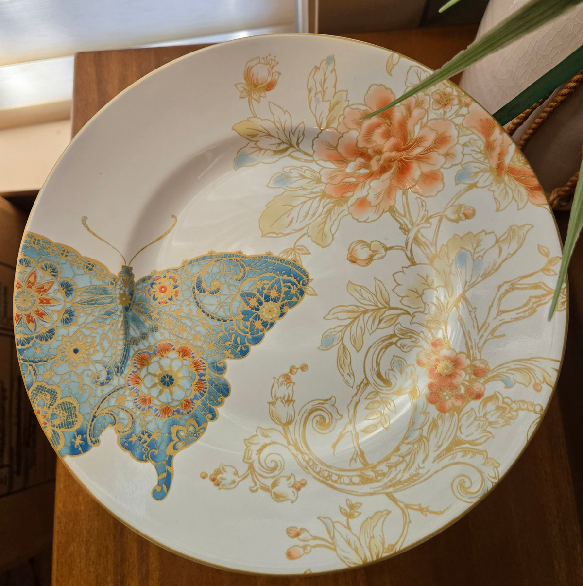 blue butterflies and brass candle holder