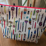 random pens themed travel bag