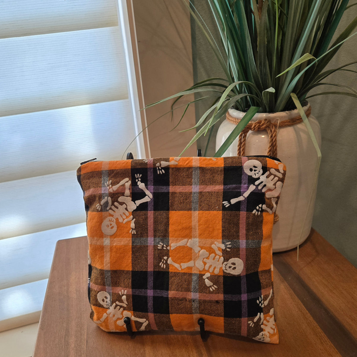 orange plaid with skeletons zipper pouch
