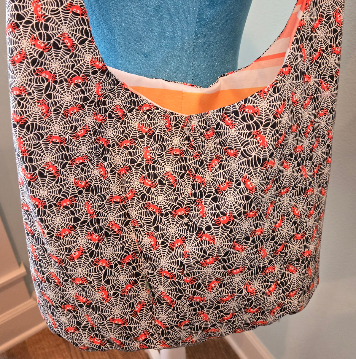 black and white spider sling purse