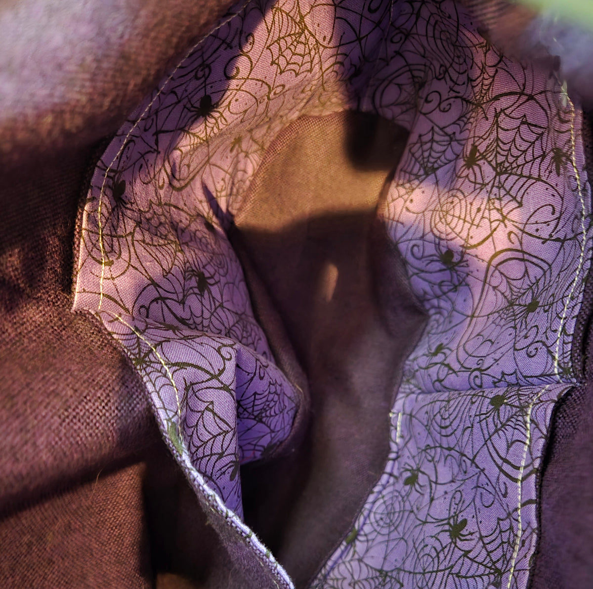purple spider sling purse