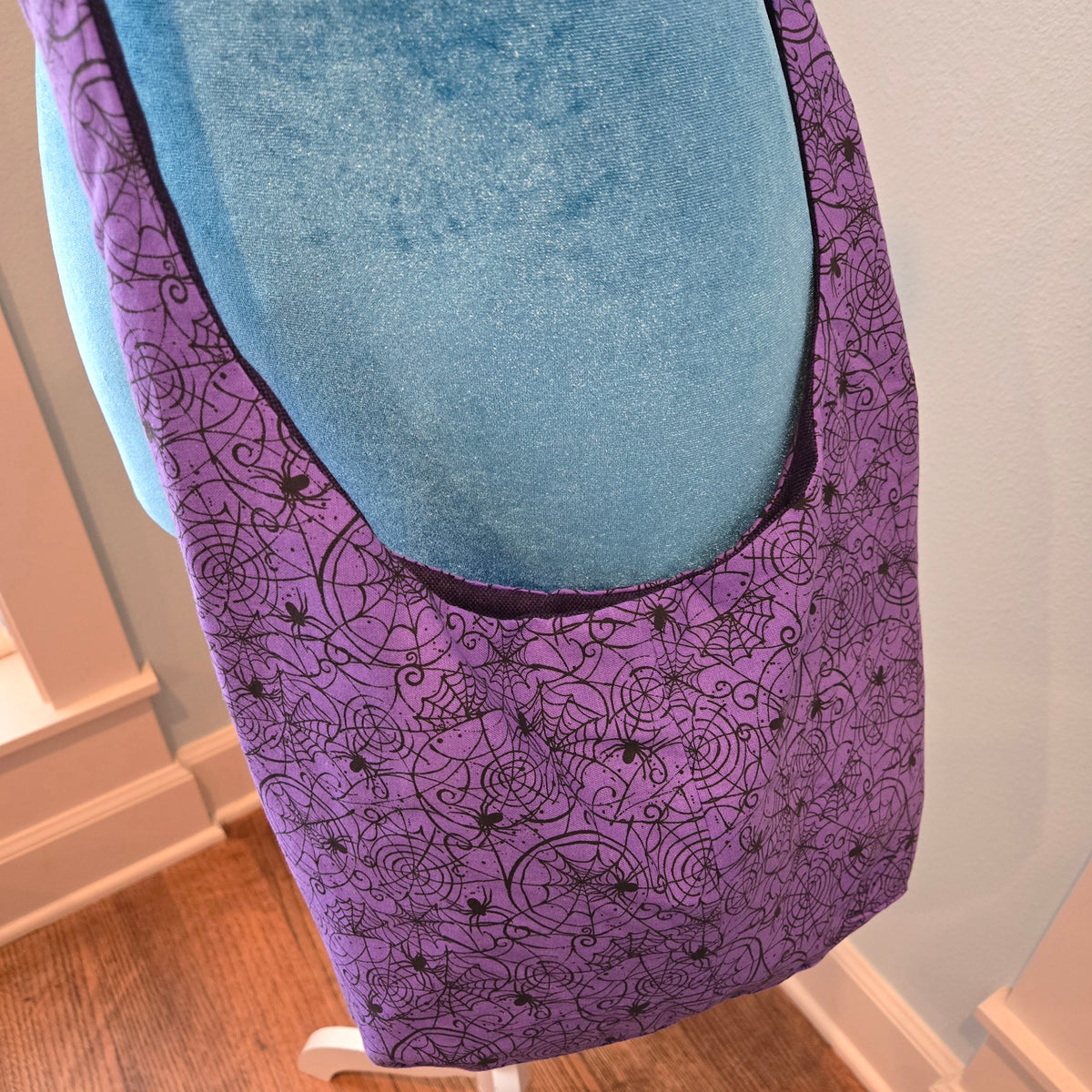 purple spider sling purse
