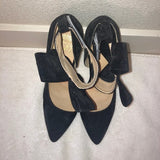 Black suede heels with detachable bows