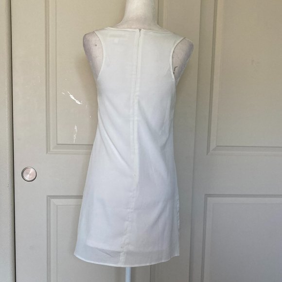 Francesca's white sleeveless ruffle front sheath dress