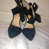 Black suede heels with detachable bows