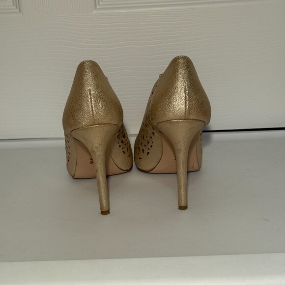 BCBGeneration gold cutout pumps