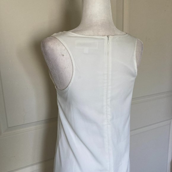 Francesca's white sleeveless ruffle front sheath dress