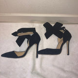 Black suede heels with detachable bows