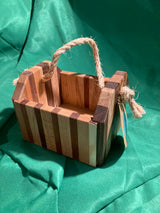 Small wood box with rope handle.