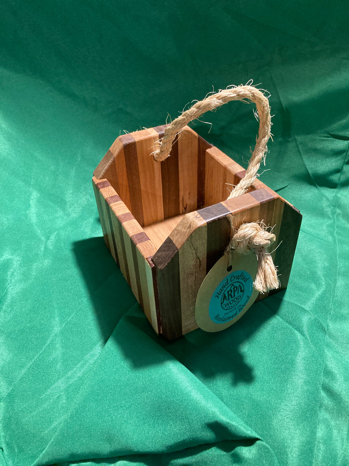 Small wood box with rope handle.