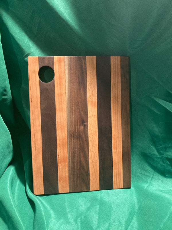 Medium wood Charcuterie board w/ hanging hole. Food prep. Hanging. Reclaimed wood. Handcrafted. High quality. Handmade gift. Walnut wood. Cherry wood.